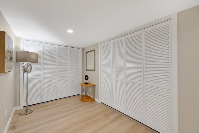 60 Indian Spring Rd, Woodstock, CT 06281 - unfurnished bedroom featuring wood finished floors, baseboards, recessed lighting, and multiple closets