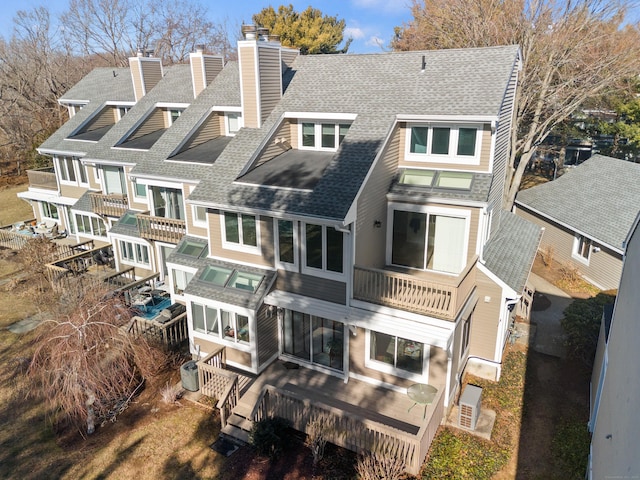 80 Seaview Ter Unit 12, Guilford, CT 06437 - rear view of house with roof with shingles, a balcony, a chimney, and a wooden deck