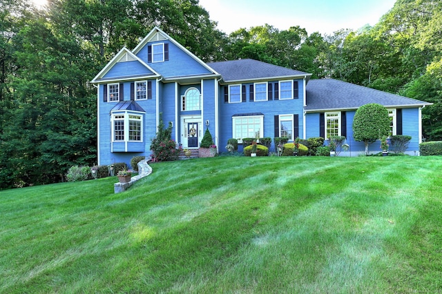 55 Riding Ridge Rd, Monroe, CT 06468 - view of front of house with a front yard and a shingled roof