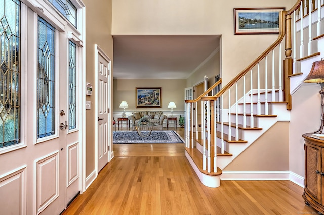 55 Riding Ridge Rd, Monroe, CT 06468 - entrance foyer featuring wood finished floors, stairway, and ornamental molding