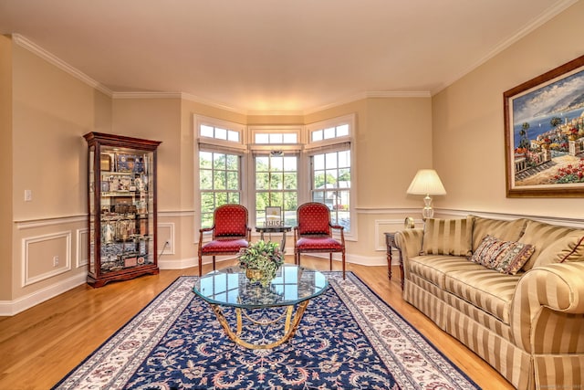 55 Riding Ridge Rd, Monroe, CT 06468 - living area with light wood finished floors, crown molding, a wainscoted wall, and a decorative wall