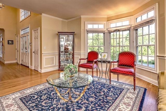 55 Riding Ridge Rd, Monroe, CT 06468 - sitting room with wood finished floors, ornamental molding, a wainscoted wall, and a decorative wall
