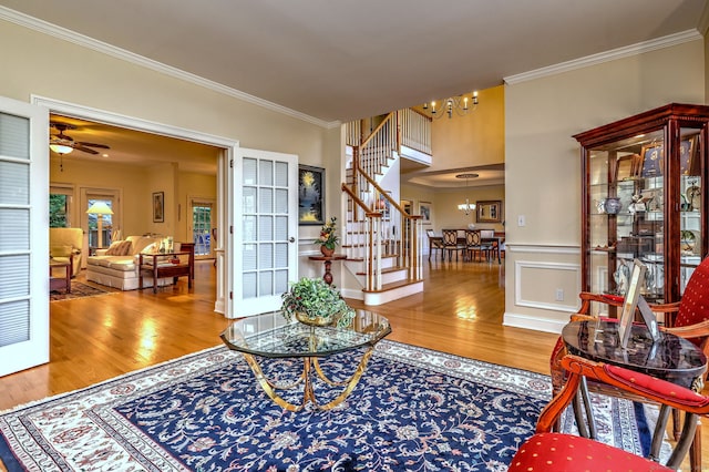 55 Riding Ridge Rd, Monroe, CT 06468 - entrance foyer with a chandelier, wood finished floors, stairs, and crown molding