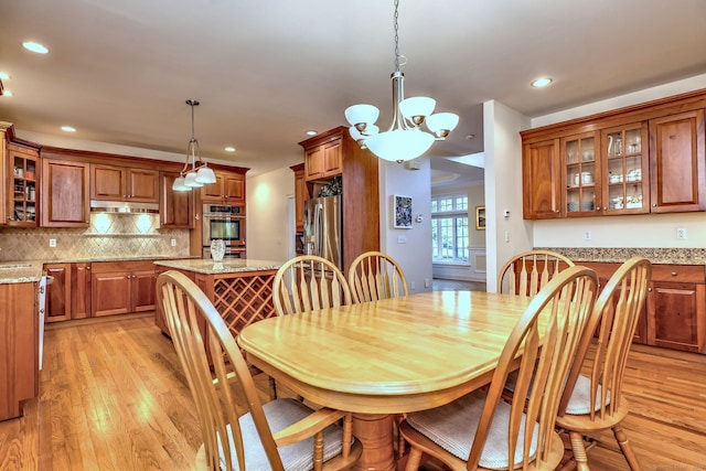 55 Riding Ridge Rd, Monroe, CT 06468 - dining space with light wood-style flooring, a chandelier, and recessed lighting