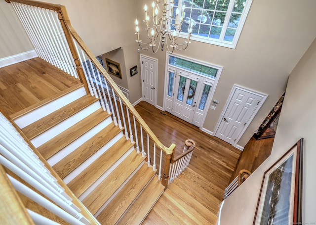 55 Riding Ridge Rd, Monroe, CT 06468 - foyer entrance with a towering ceiling, wood finished floors, a chandelier, and stairs