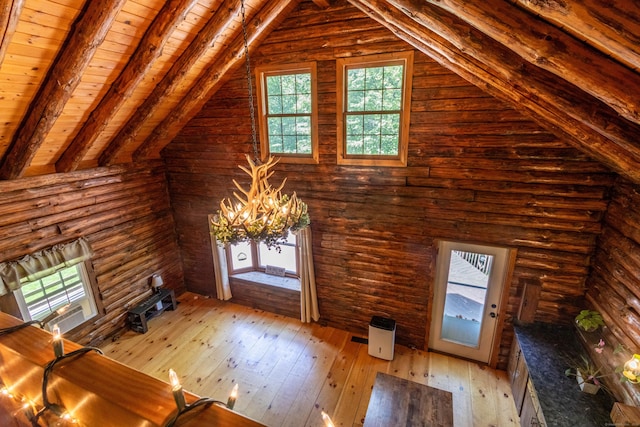 112 Edstrom Rd, Marlborough, CT 06447 - unfurnished living room with a chandelier, wooden ceiling with exposed beams, light wood-style floors, and high vaulted ceiling
