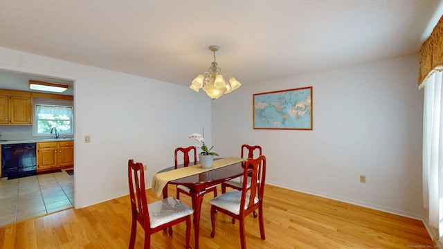 26 Reno Dr, Middletown, CT 06457 - dining room with a chandelier, light wood-type flooring, and baseboards