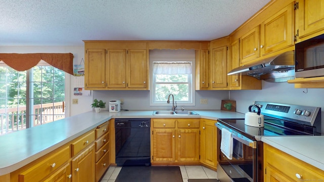 26 Reno Dr, Middletown, CT 06457 - kitchen with appliances with stainless steel finishes, under cabinet range hood, a sink, healthy amount of natural light, and a textured ceiling