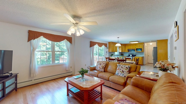 26 Reno Dr, Middletown, CT 06457 - living area with a baseboard heating unit, a textured ceiling, light wood-style floors, and a ceiling fan