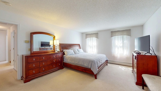 26 Reno Dr, Middletown, CT 06457 - bedroom with a baseboard heating unit, carpet, and a textured ceiling