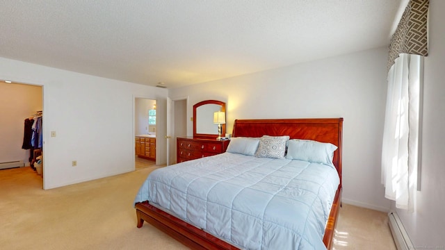 26 Reno Dr, Middletown, CT 06457 - bedroom with carpet flooring, baseboard heating, a spacious closet, and ensuite bath