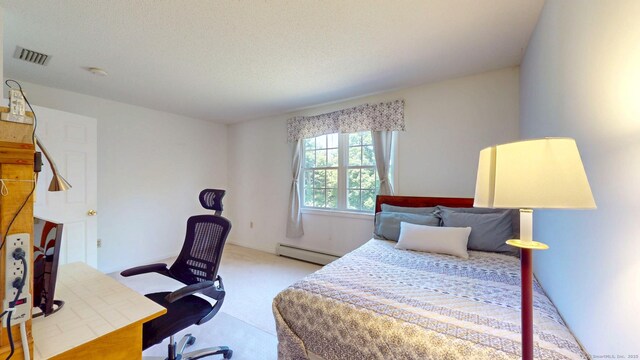 26 Reno Dr, Middletown, CT 06457 - carpeted bedroom featuring a baseboard heating unit and a desk