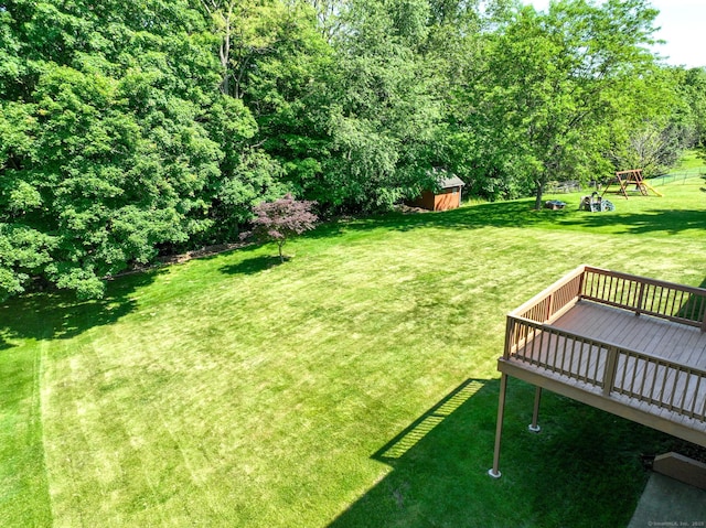 26 Reno Dr, Middletown, CT 06457 - view of green lawn featuring a deck and a playground
