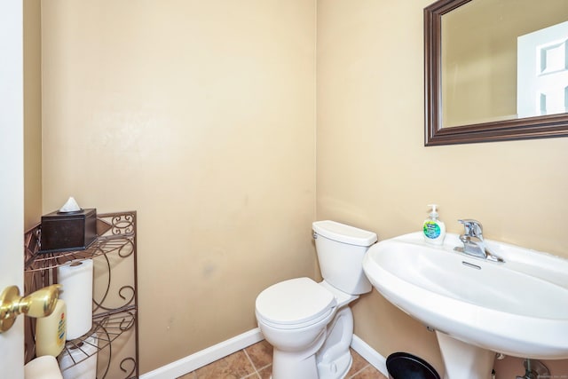 280 Ridgefield Ave, Waterbury, CT 06705 - half bathroom with toilet, baseboards, a sink, and tile patterned floors