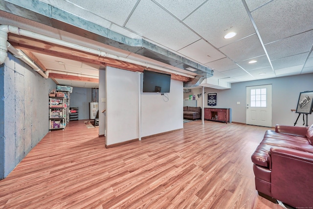 280 Ridgefield Ave, Waterbury, CT 06705 - below grade area featuring light wood-style flooring, water heater, and a drop ceiling