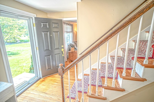 49 Hintz Dr, Wallingford, CT 06492 - foyer entrance with plenty of natural light, light wood-style flooring, and stairs