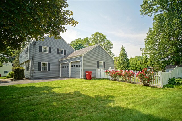 49 Hintz Dr, Wallingford, CT 06492 - rear view of property featuring driveway and an attached garage