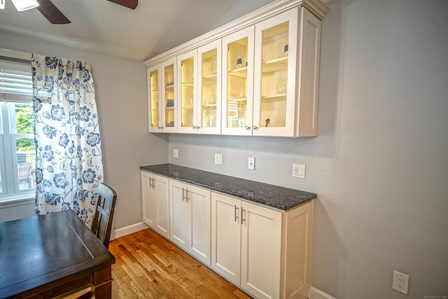49 Hintz Dr, Wallingford, CT 06492 - bar area featuring a ceiling fan, light wood finished floors, and baseboards