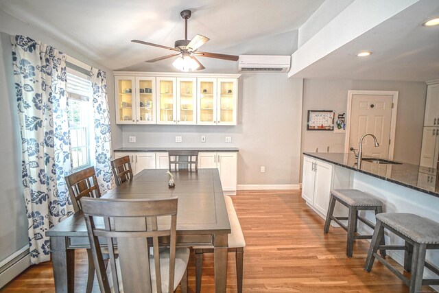 49 Hintz Dr, Wallingford, CT 06492 - dining space featuring a baseboard heating unit, a wall mounted AC, ceiling fan, light wood-style flooring, and recessed lighting