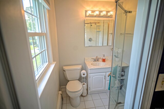 49 Hintz Dr, Wallingford, CT 06492 - bathroom with tile patterned flooring, baseboard heating, toilet, a stall shower, and vanity
