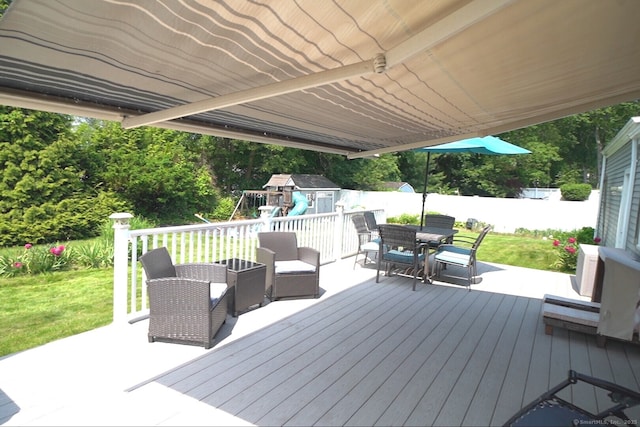 49 Hintz Dr, Wallingford, CT 06492 - wooden deck with outdoor dining space and a playground