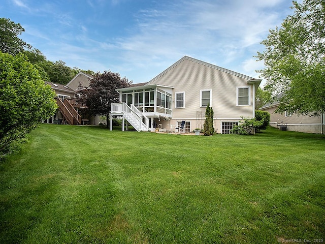 3 Timberland Way Unit 3, Beacon Falls, CT 06403 - back of house with a sunroom, stairs, and a yard