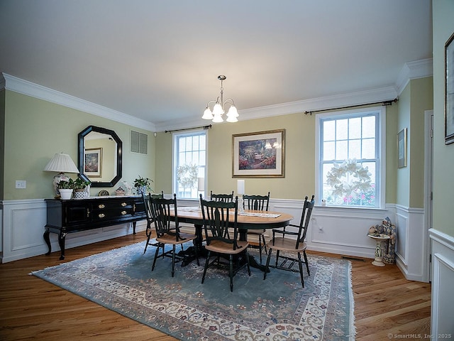 3 Timberland Way Unit 3, Beacon Falls, CT 06403 - dining room with a chandelier, crown molding, a wainscoted wall, and wood finished floors