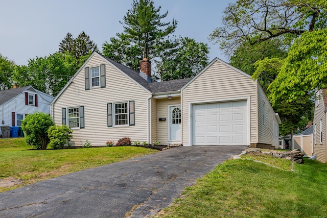 170 Morningside Dr E, Bristol, CT 06010 - view of front facade with a chimney, asphalt driveway, a front yard, an attached garage, and roof with shingles