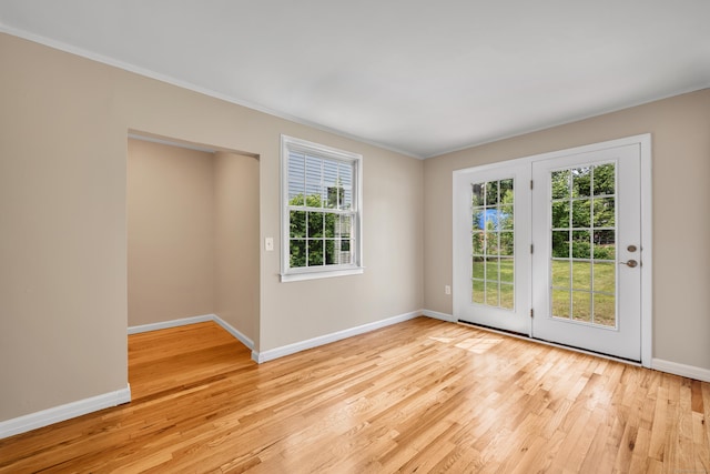 170 Morningside Dr E, Bristol, CT 06010 - empty room featuring light wood-type flooring, healthy amount of natural light, baseboards, and crown molding