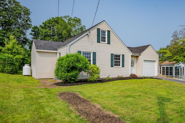 170 Morningside Dr E, Bristol, CT 06010 - view of front facade featuring a garage, driveway, roof with shingles, and a front lawn