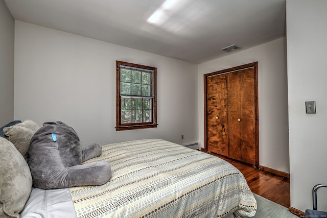 31 Country Ridge Dr, Monroe, CT 06468 - bedroom featuring wood finished floors, a closet, and a baseboard heating unit