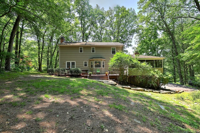 31 Country Ridge Dr, Monroe, CT 06468 - rear view of property with a chimney, a wooden deck, and a sunroom