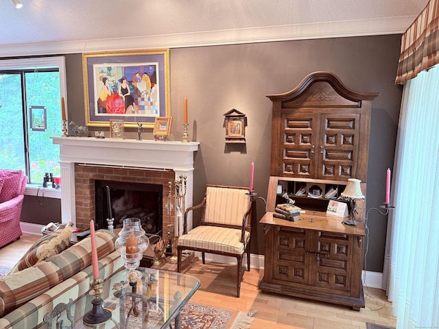 12 Heritage Crst Unit E, Southbury, CT 06488 - living room with ornamental molding, a brick fireplace, and wood finished floors