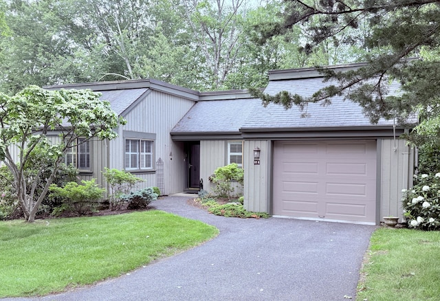 12 Heritage Crst Unit E, Southbury, CT 06488 - view of front of house featuring a garage, asphalt driveway, and a front lawn