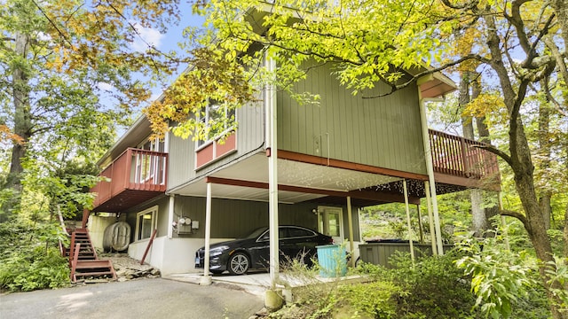 23 Rockmeadow Rd, Norwalk, CT 06850 - view of side of property with stairway and a wooden deck