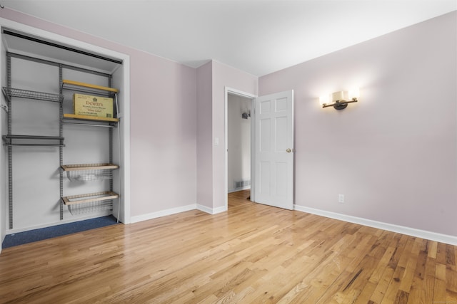 23 Rockmeadow Rd, Norwalk, CT 06850 - unfurnished bedroom with wood finished floors, baseboards, and a closet