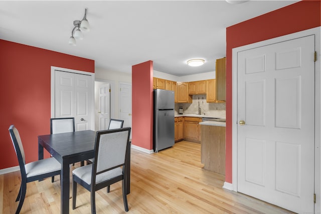 23 Rockmeadow Rd, Norwalk, CT 06850 - dining area featuring light wood-type flooring and baseboards
