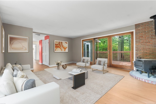 23 Rockmeadow Rd, Norwalk, CT 06850 - living area with a wood stove, wood finished floors, and baseboards