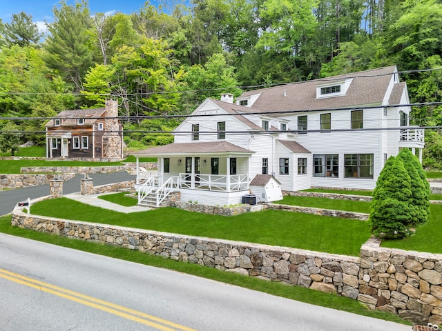 153 Valley Forge Rd, Weston, CT 06883 - back of property featuring a porch and a yard
