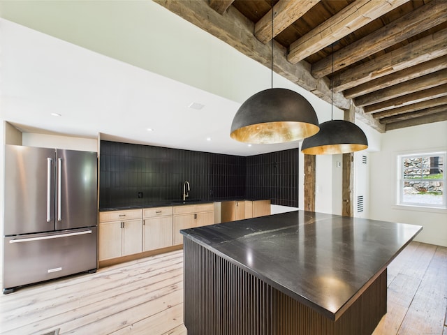 153 Valley Forge Rd, Weston, CT 06883 - kitchen with high end fridge, dark countertops, light wood-style floors, a sink, and wood ceiling with exposed beams