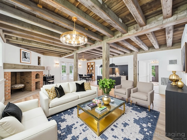 153 Valley Forge Rd, Weston, CT 06883 - living area with a chandelier, wooden ceiling with exposed beams, healthy amount of natural light, wood finished floors, and french doors