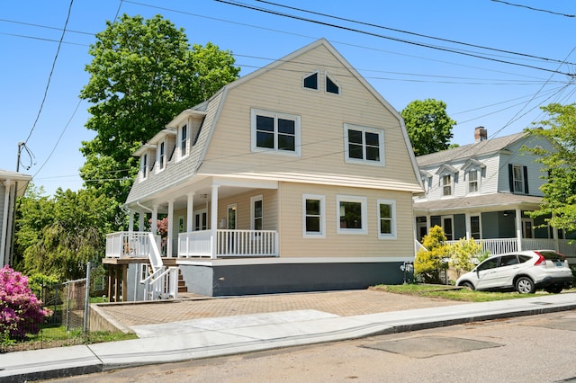 46 Park St, New London, CT 06320 - colonial inspired home with covered porch, a gambrel roof, and stairway