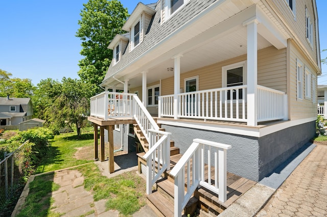 46 Park St, New London, CT 06320 - view of home's exterior featuring a porch, a shingled roof, and stairway