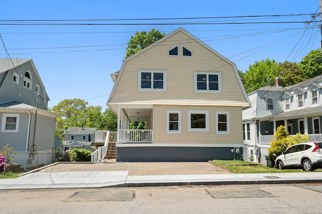46 Park St, New London, CT 06320 - dutch colonial featuring a gambrel roof, a porch, and stairs