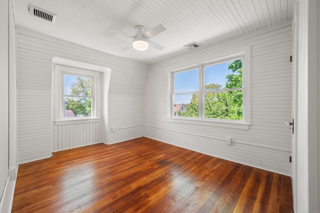 46 Park St, New London, CT 06320 - spare room featuring dark wood-style floors, a ceiling fan, and wooden walls