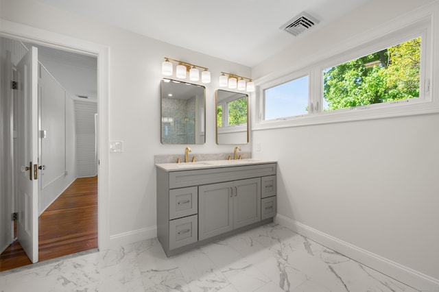 46 Park St, New London, CT 06320 - full bath featuring baseboards, double vanity, and marble finish floors