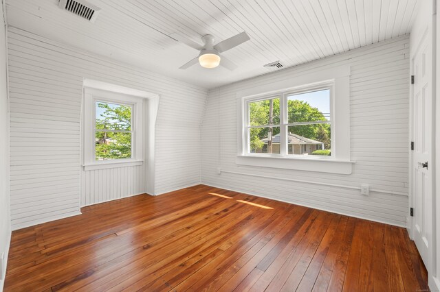 46 Park St, New London, CT 06320 - unfurnished room featuring hardwood / wood-style flooring, a ceiling fan, and wood walls