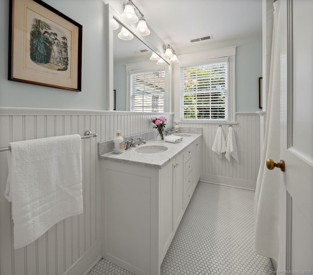 108 Clapboard Hill Rd, Westport, CT 06880 - bathroom with double vanity and wainscoting