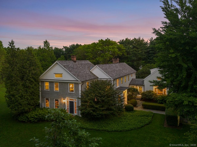 108 Clapboard Hill Rd, Westport, CT 06880 - view of front of home with a chimney and a front yard