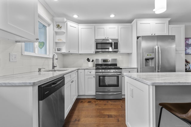 92 Lafayette St Apt 5, Stamford, CT 06902 - kitchen featuring appliances with stainless steel finishes, white cabinets, dark wood-type flooring, light stone counters, and recessed lighting